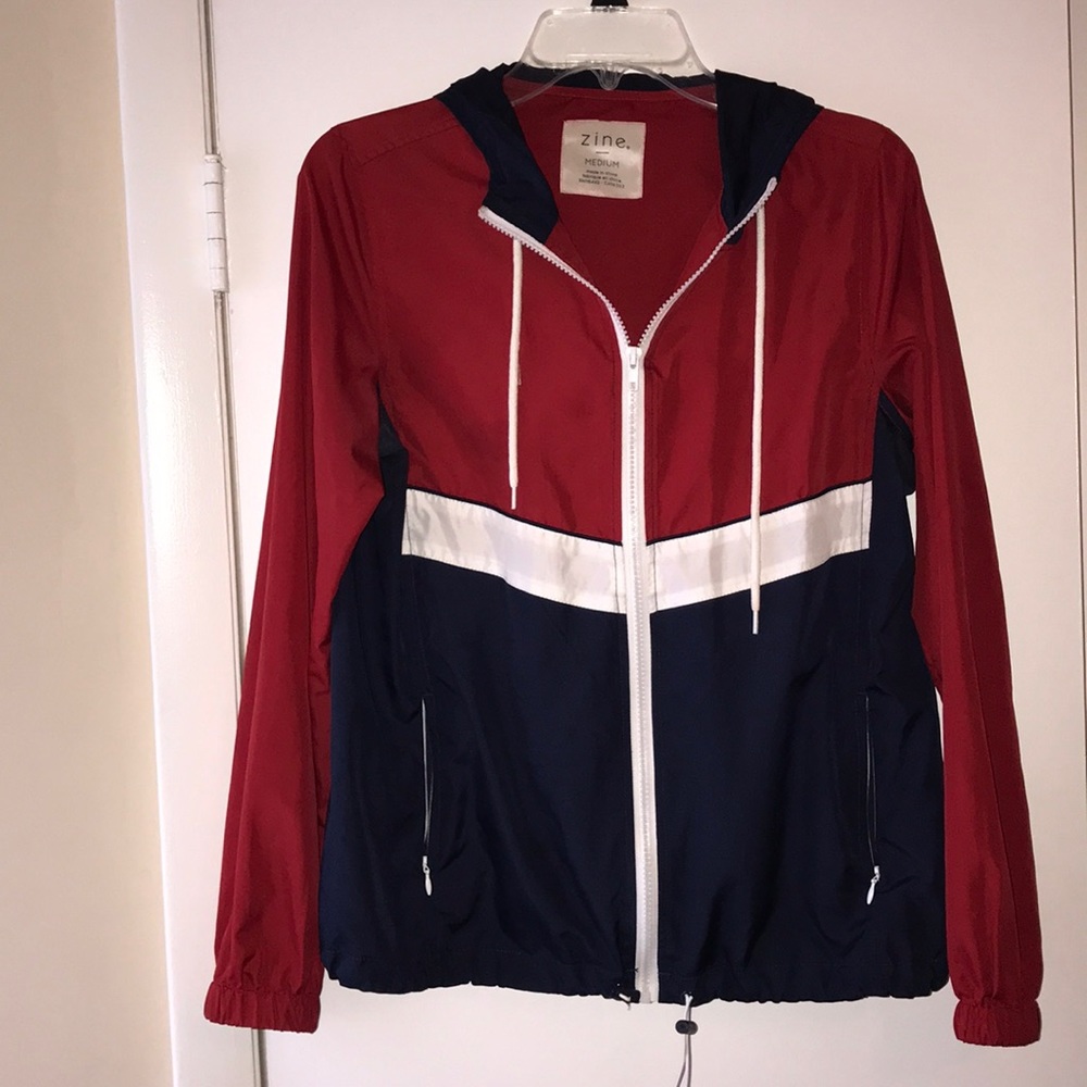 Red, white and navy blue wind breaker jacket.